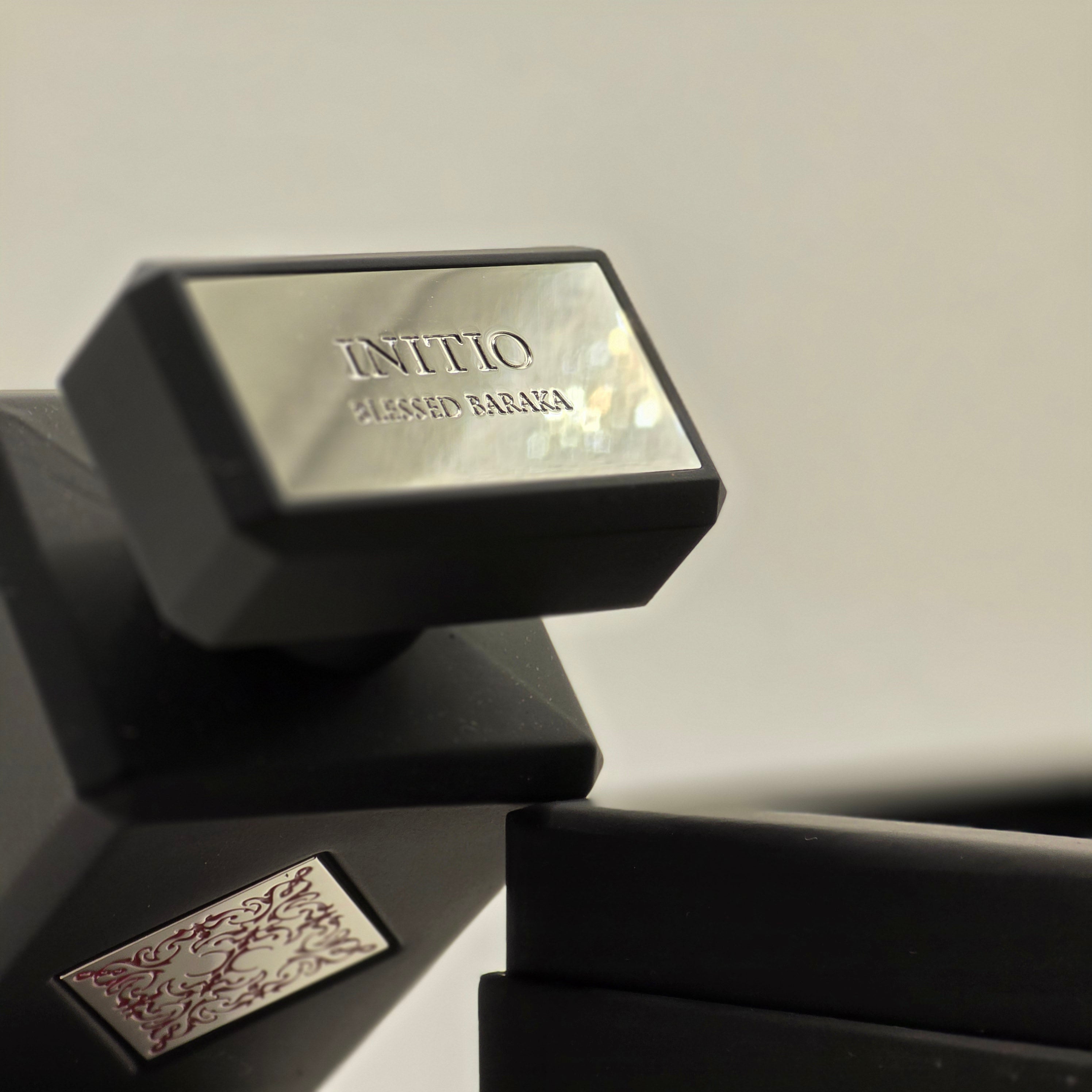 Image of Initio Parfums Privés fragrance bottle photographed in a minimalist setting