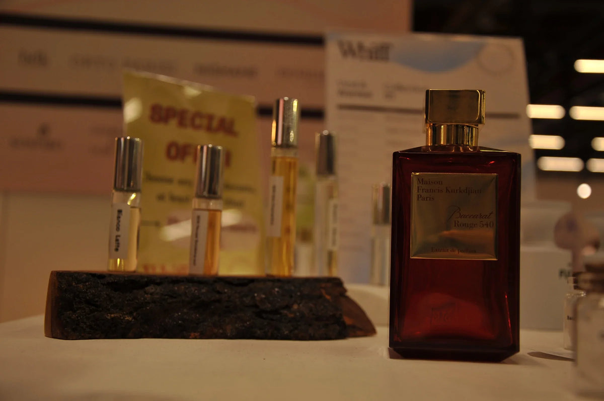 Luxury niche perfume bottles displayed at the WHIFF fragrance stand at a beauty event